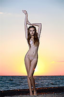 Elle Tan naked on the beach
