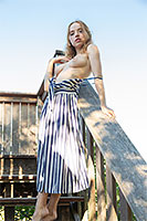 Ukrainian beauty Rinna poses topless outdoor