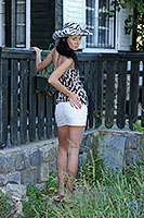 Gina Devine in white miniskirt outdoor
